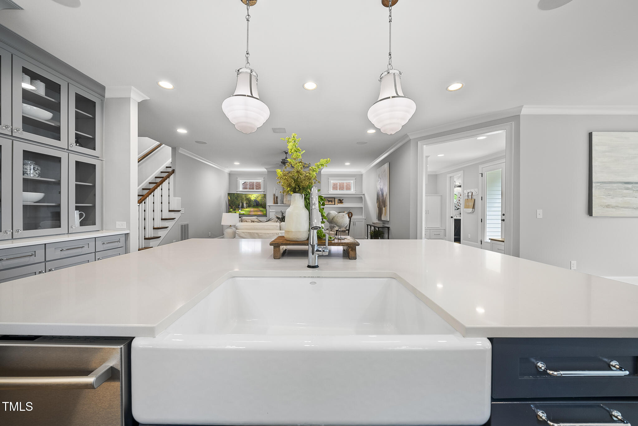 1306 Mordecai Drive Raleigh, NC 27604 - Photo 16 of 78 a large kitchen with a sink and chandelier