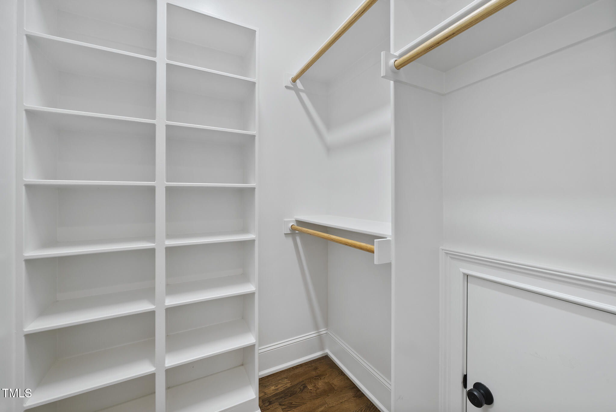 1306 Mordecai Drive Raleigh, NC 27604 - Photo 28 of 78 a view of walk in closet with empty racks