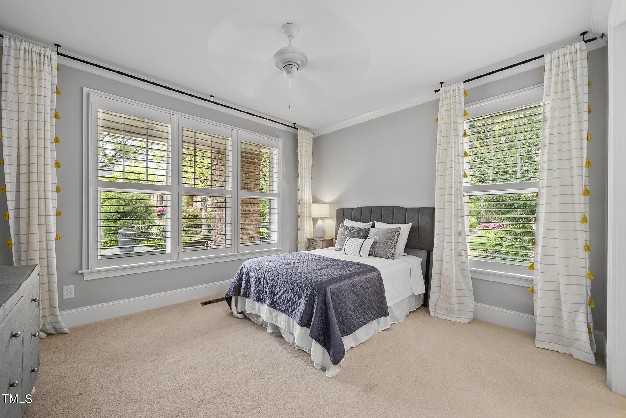 1306 Mordecai Drive Raleigh, NC 27604 - Photo 47 of 78 a spacious bedroom with a bed and a large window