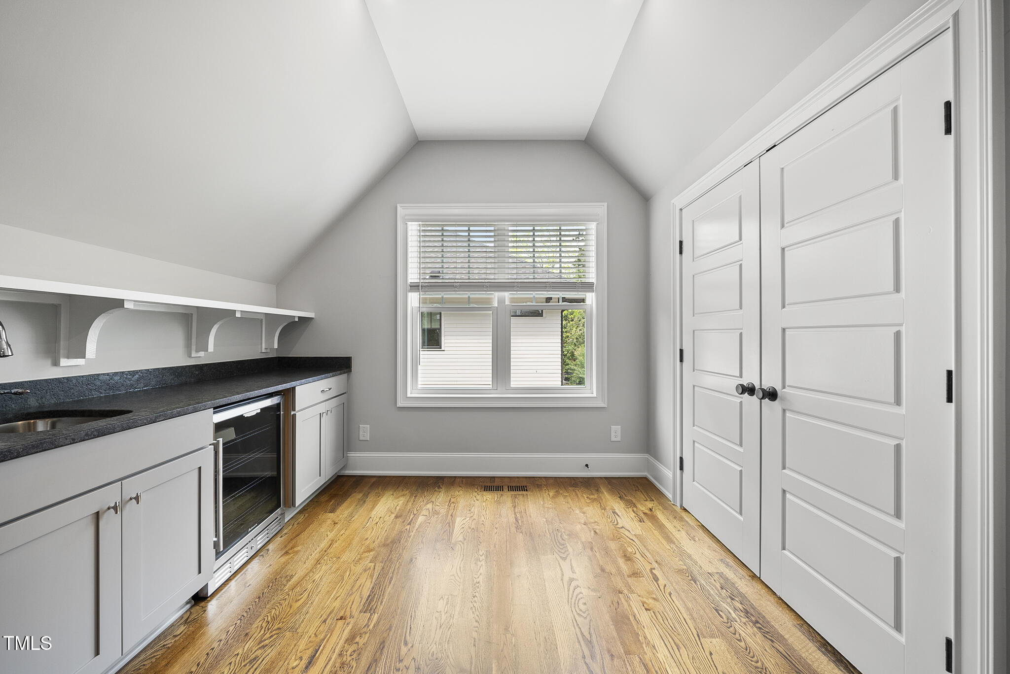 1306 Mordecai Drive Raleigh, NC 27604 - Photo 63 of 78 wooden floor in an empty room with a window