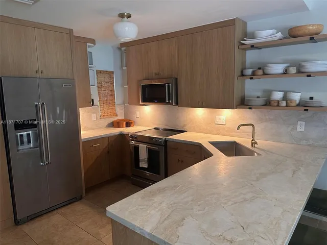 a patio with a table and chairs