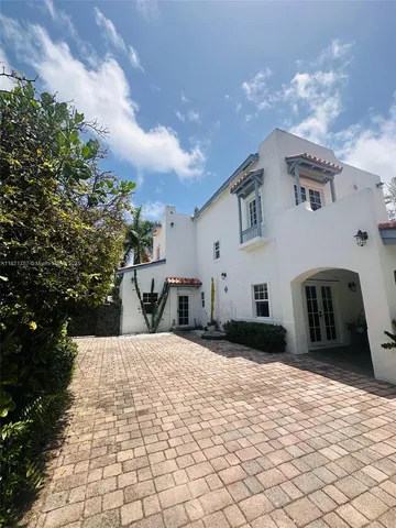 a front view of house with yard and outdoor seating