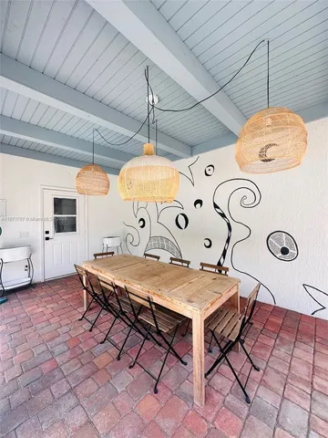 a view of a swimming pool and patio in the backyard