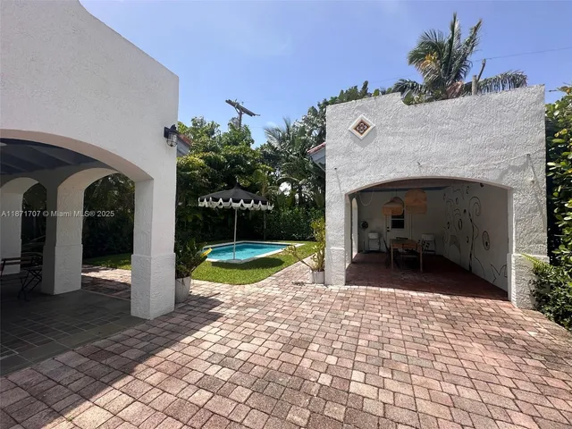 a view of bathroom with a sink and a mirror