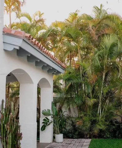 a bathroom with a tub a toilet and a sink