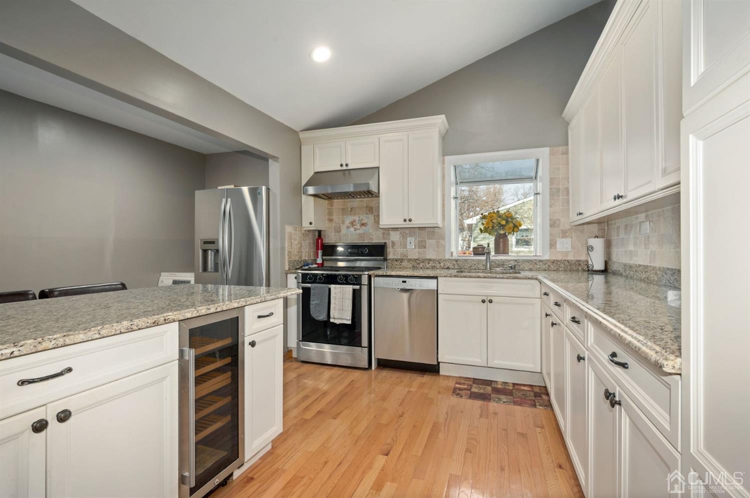 24 Partch Place Edison, NJ 08817 - Photo 2 of 22 a kitchen with a sink stove and refrigerator