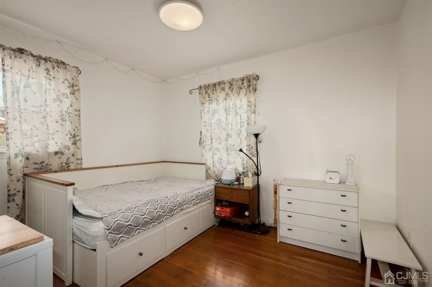 24 Partch Place Edison, NJ 08817 - Photo 11 of 22 a bedroom with a bed and a dresser