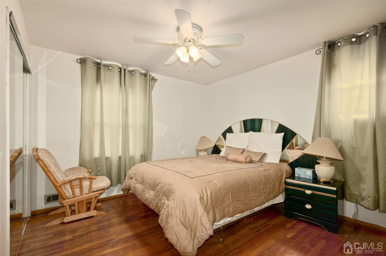 24 Partch Place Edison, NJ 08817 - Photo 13 of 22 a bedroom with a bed and a chandelier