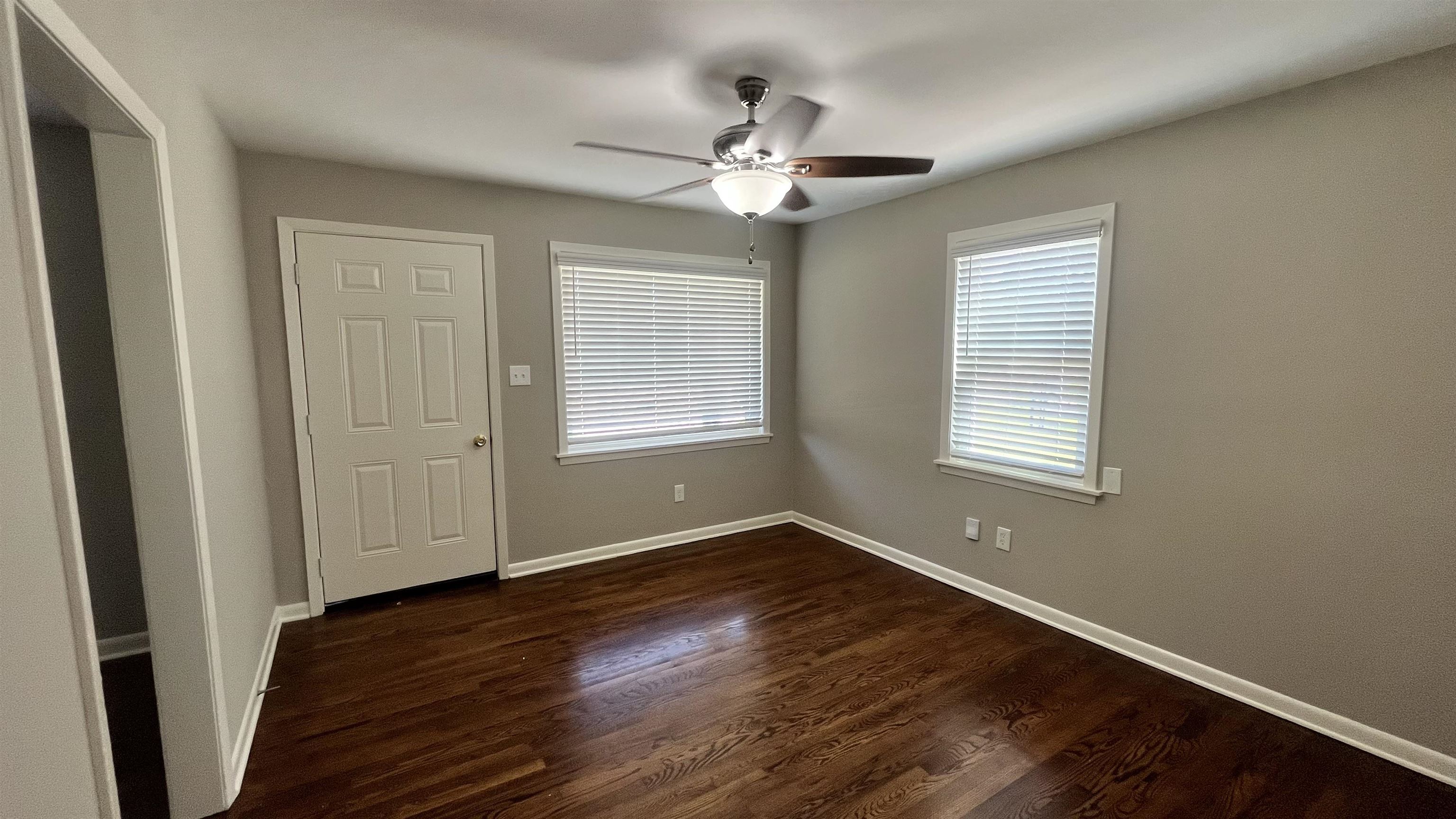 121 West Street Collierville, TN 38017 - Photo 8 of 16 a view of an empty room with wooden floor and a window