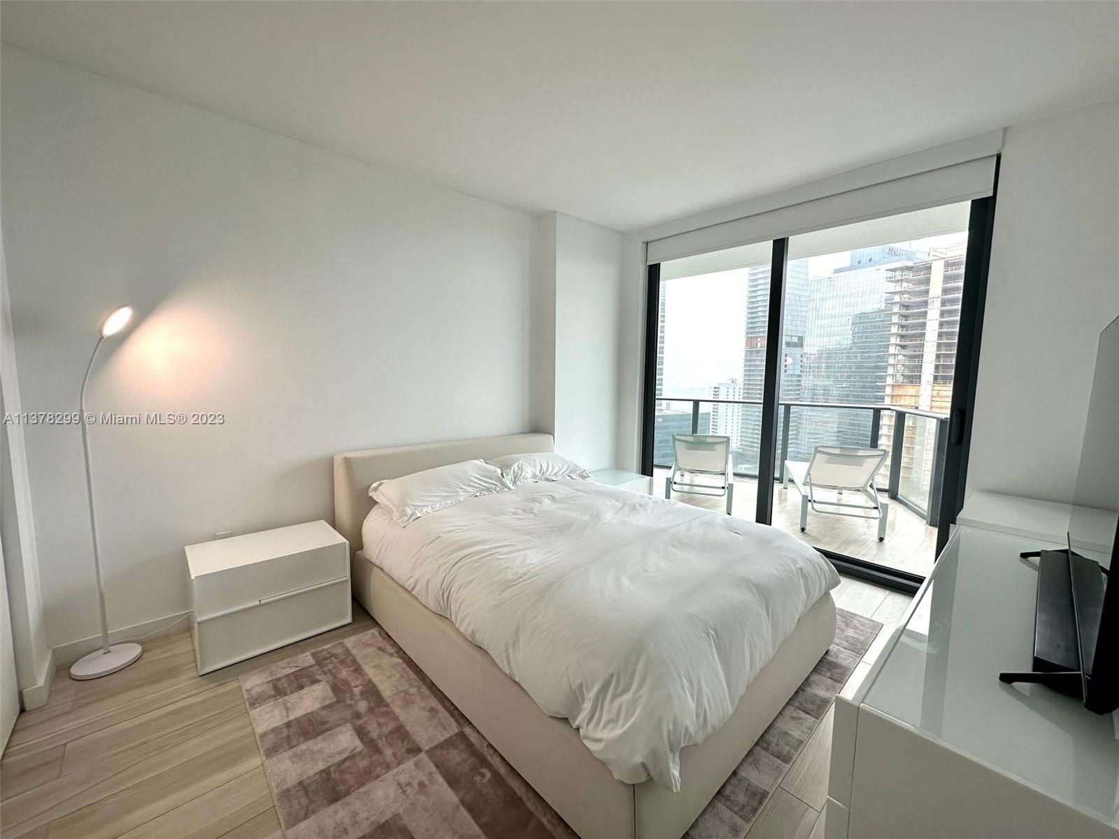 Brickell Miami, FL 33130 - Photo 11 of 17 a bedroom with a bed and a large window