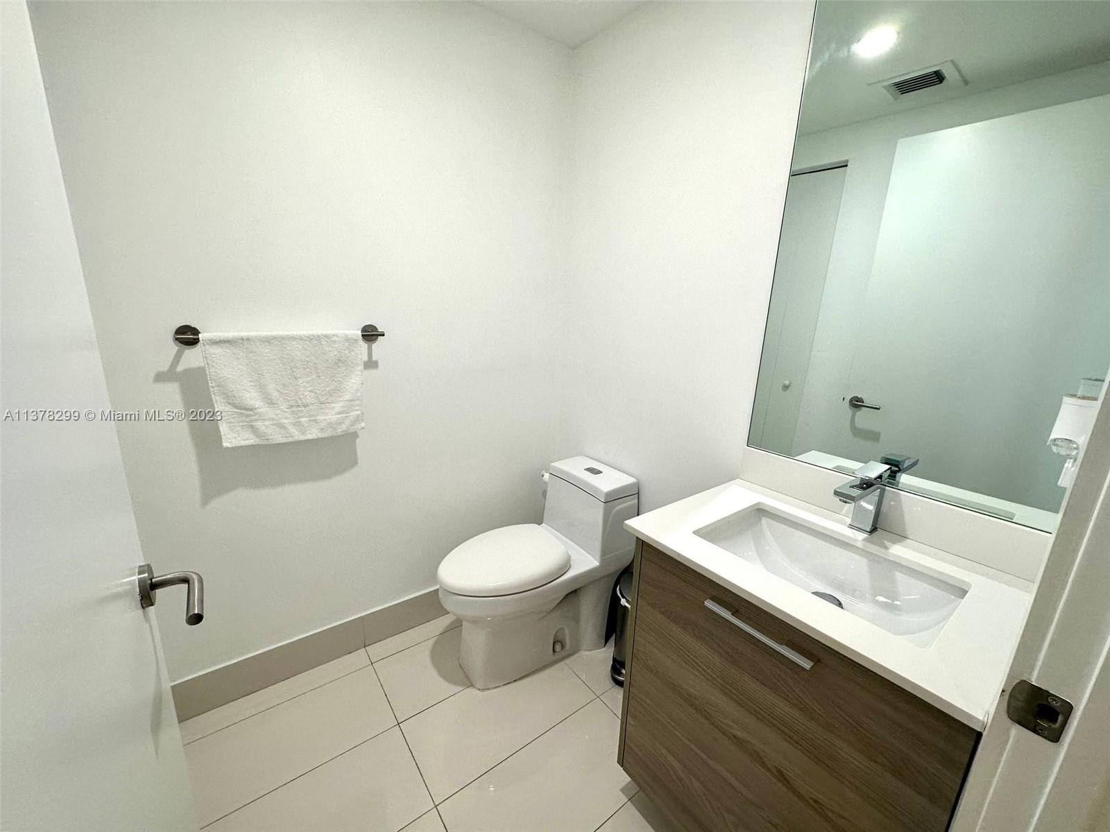 Brickell Miami, FL 33130 - Photo 15 of 17 a bathroom with a sink and a toilet