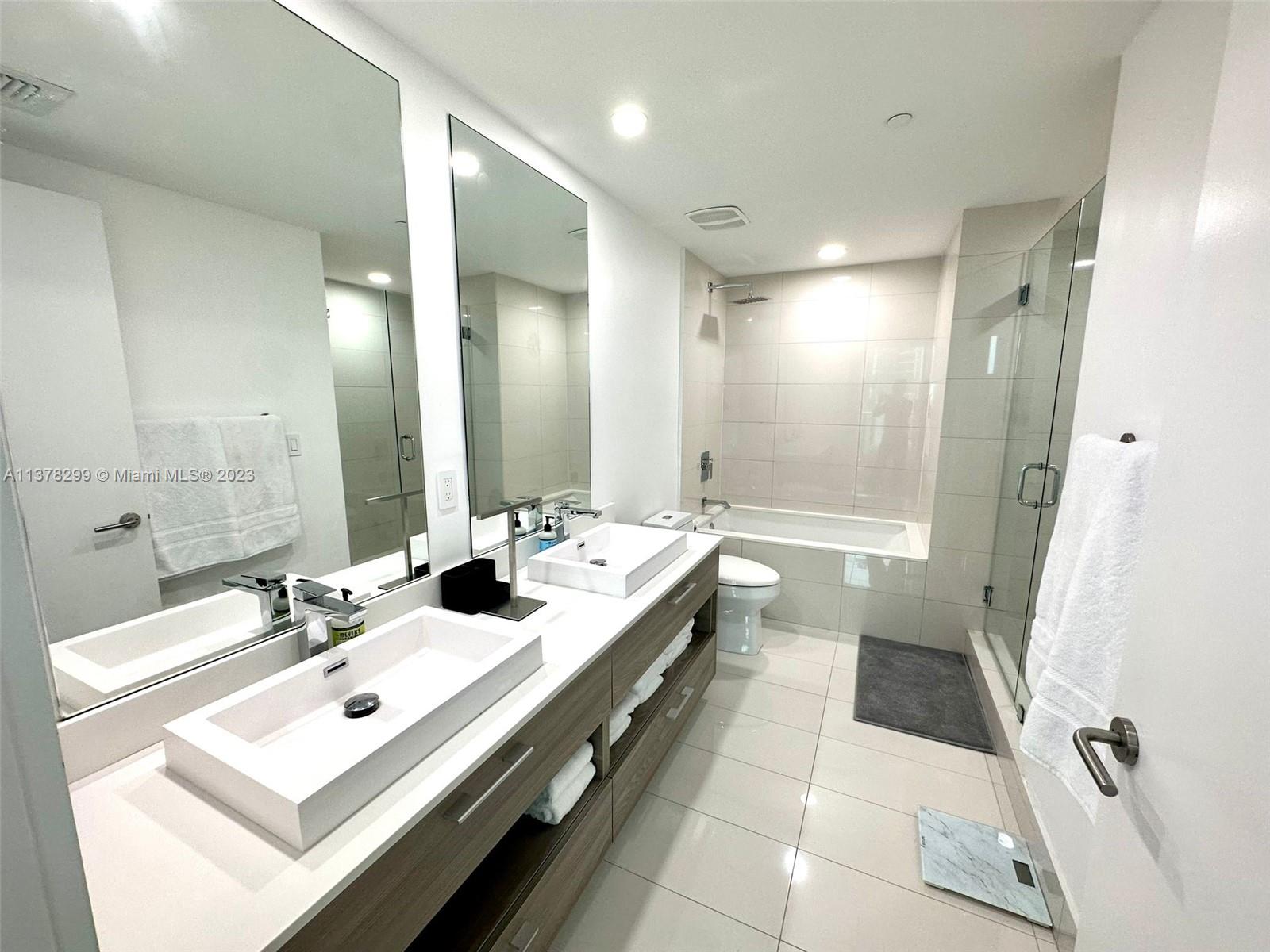 Brickell Miami, FL 33130 - Photo 16 of 17 a bathroom with a double vanity sink mirror double and shower