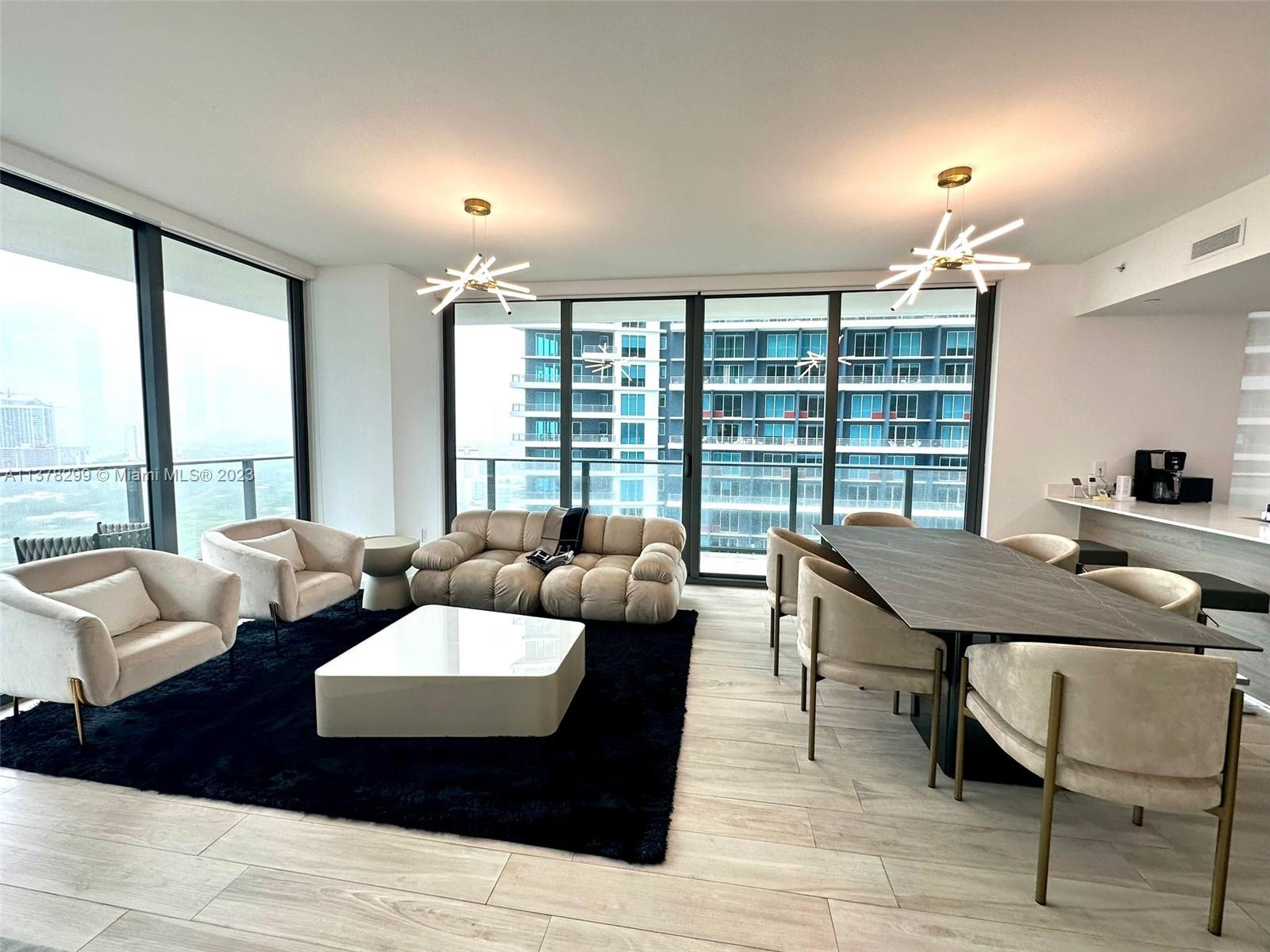 Brickell Miami, FL 33130 - Photo 2 of 17 a living room with furniture and a large window