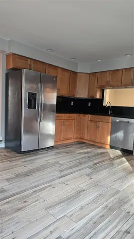 a view of a livingroom with wooden floor
