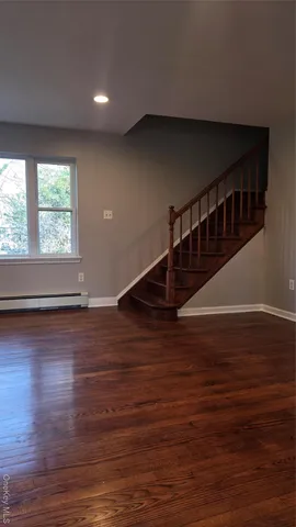 a view of entryway with wooden floor