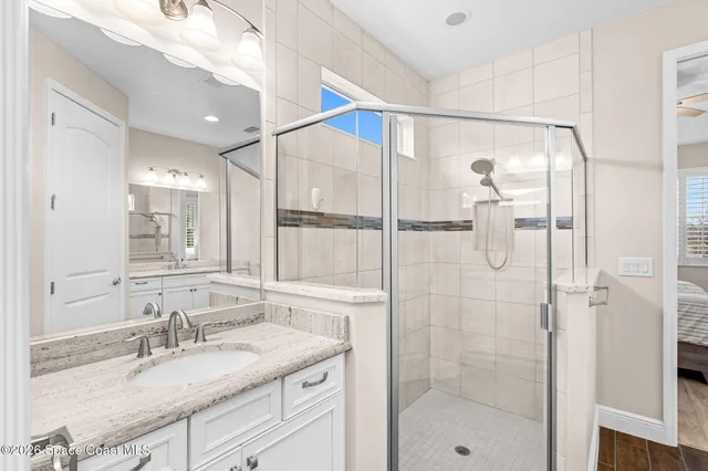 a bathroom with a granite countertop sink mirror and double