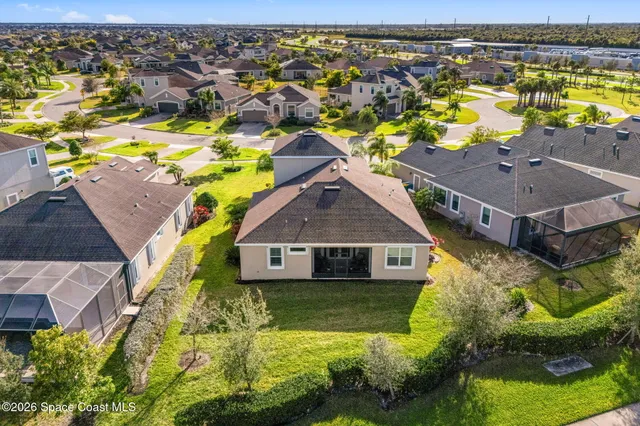 an aerial view of residential houses with swimming pool