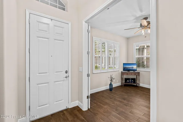 a view of livingroom with hardwood floor and a ceiling fan