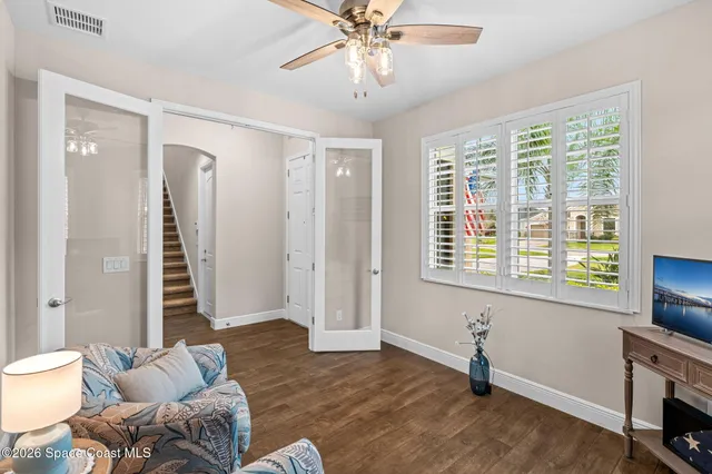 a living room with furniture and a window
