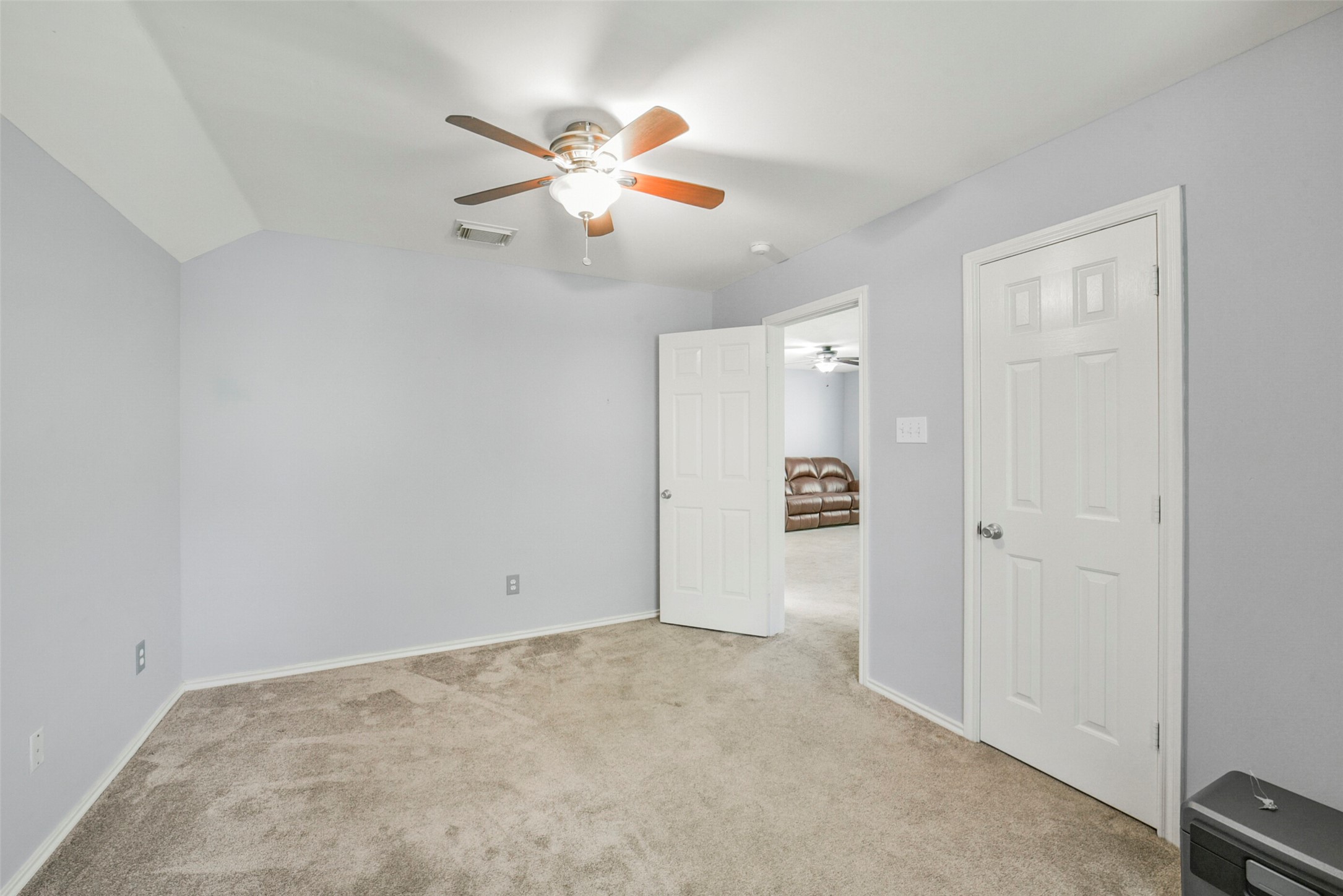 38 Tallow Hill Place Spring, TX 77382 - Photo 35 of 50 an empty room with closet and a chandelier fan
