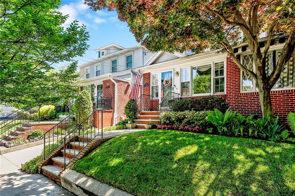 7607 Colonial Road Brooklyn, NY 11209 - Photo 30 of 35 a front view of a house with a yard and potted plants