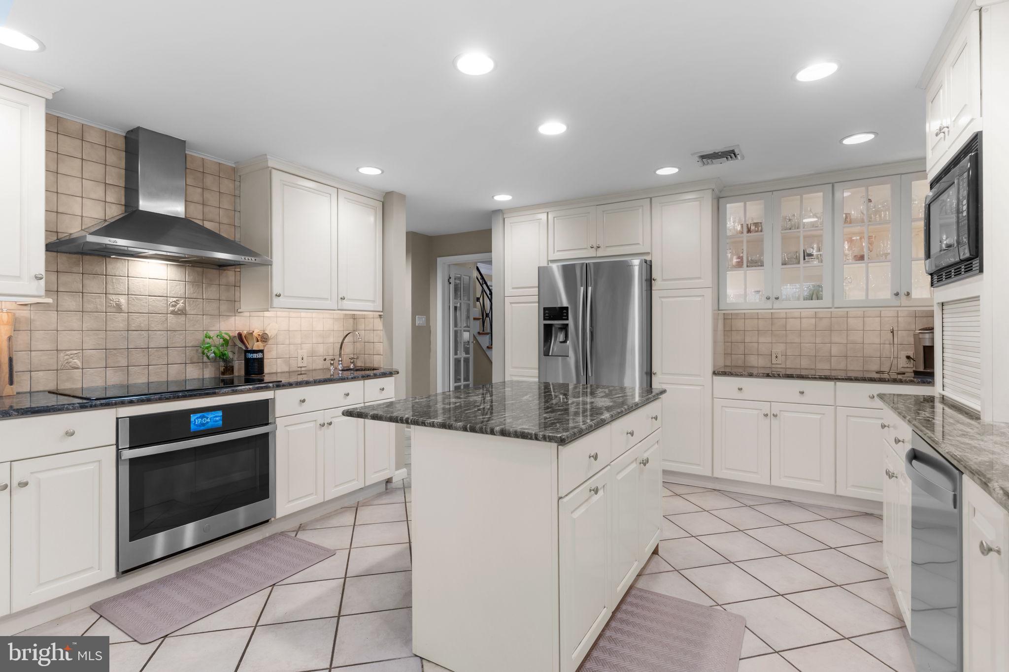 4 Keats Road Yardley, PA 19067 - Photo 18 of 65 a kitchen with stainless steel appliances kitchen island granite countertop a sink and cabinets