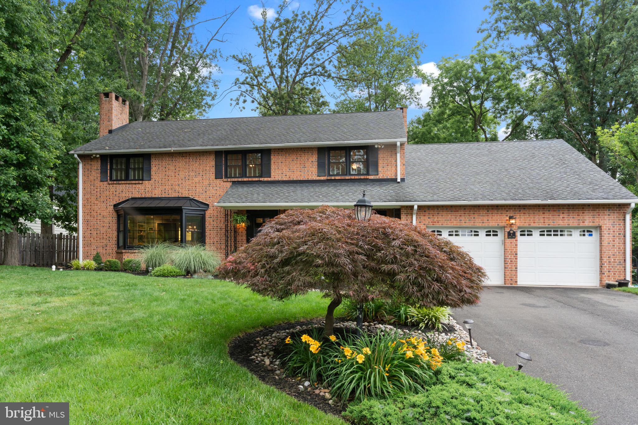 4 Keats Road Yardley, PA 19067 - Photo 2 of 65 a front view of a house with a garden and plants