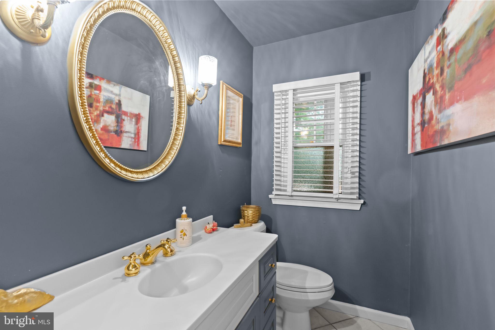 4 Keats Road Yardley, PA 19067 - Photo 21 of 65 a bathroom with a sink and a mirror