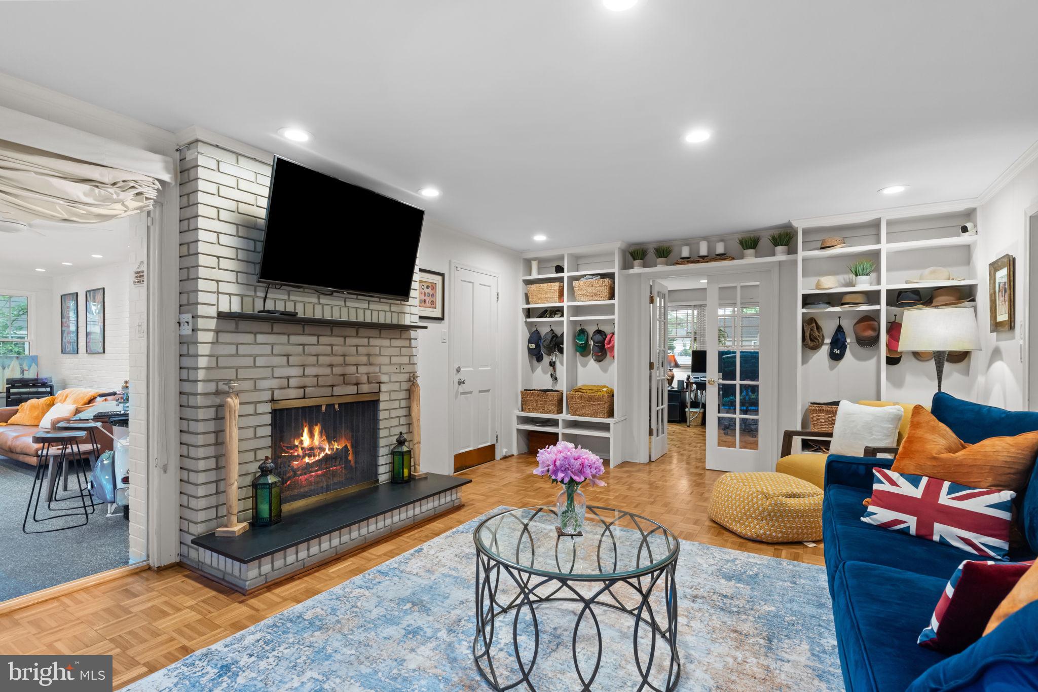 4 Keats Road Yardley, PA 19067 - Photo 23 of 65 a living room with furniture a flat screen tv and a fireplace