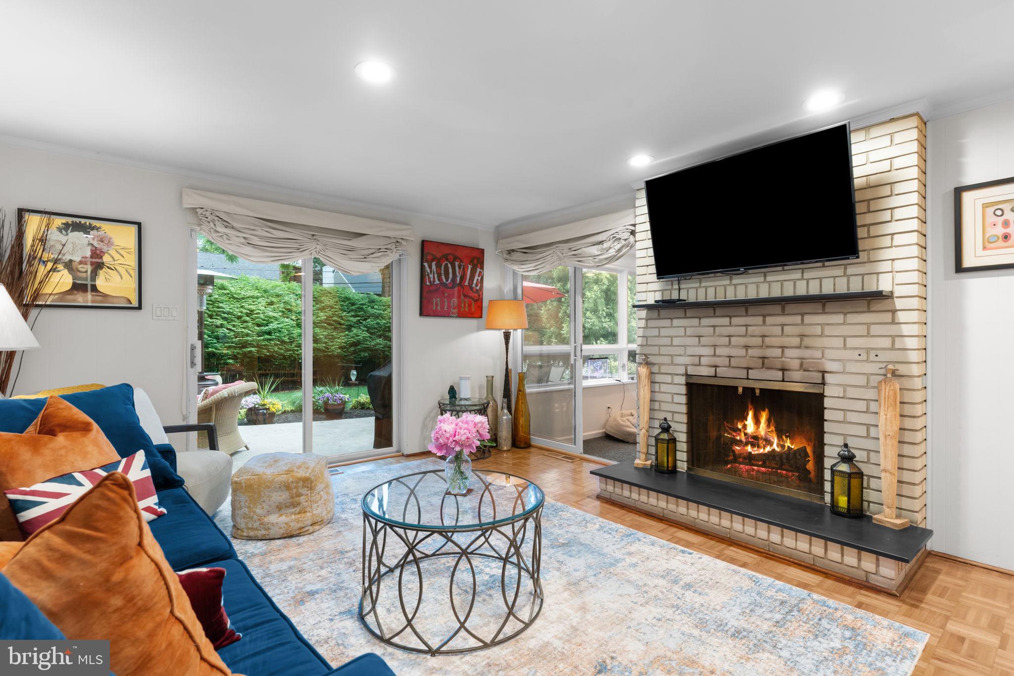 4 Keats Road Yardley, PA 19067 - Photo 24 of 65 a living room with furniture a flat screen tv and a fireplace