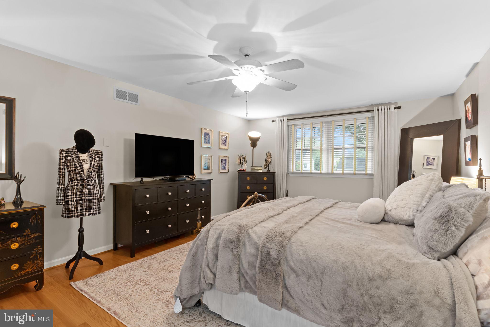 4 Keats Road Yardley, PA 19067 - Photo 34 of 65 a bedroom with a large bed and a flat screen tv