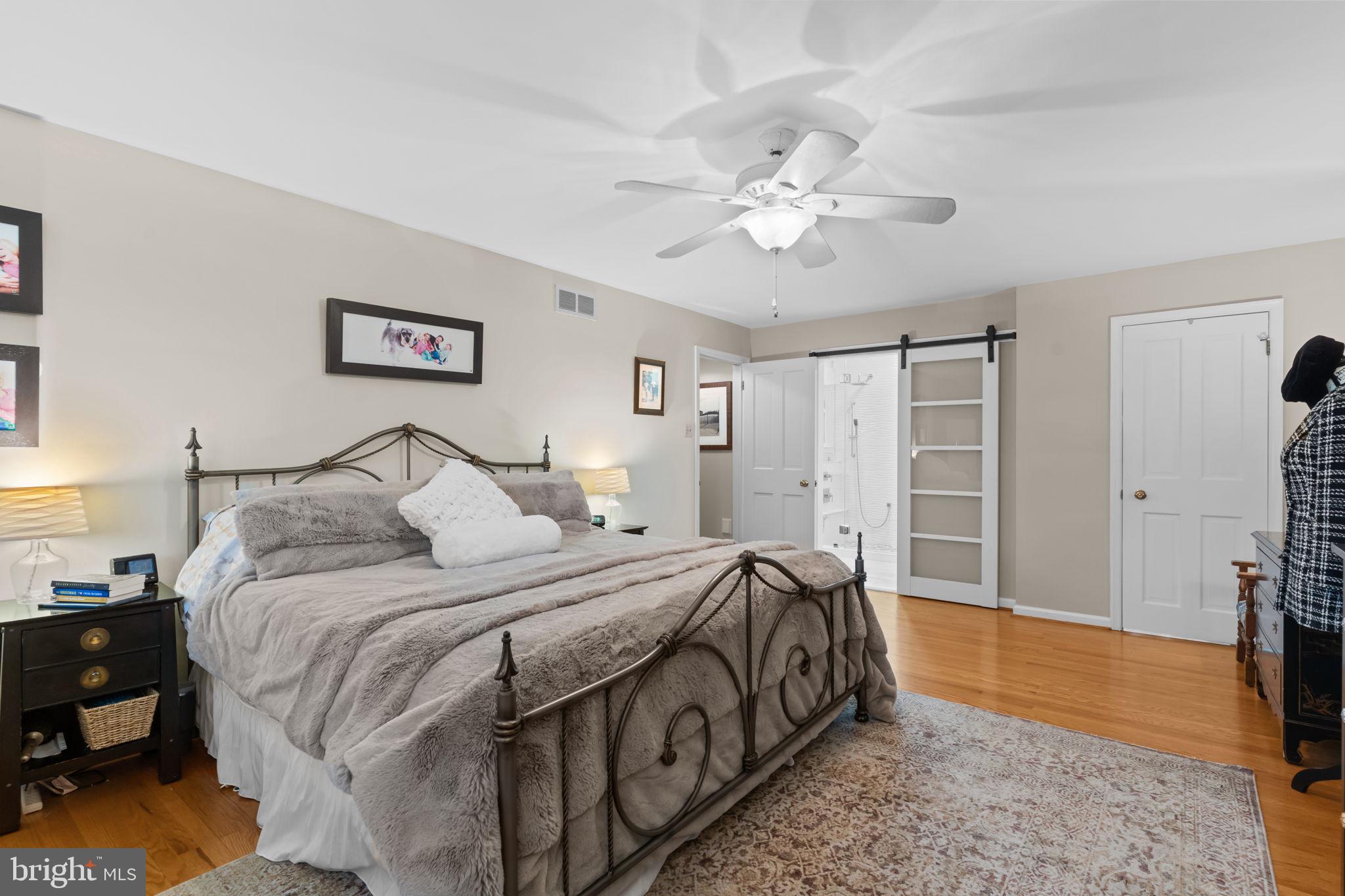 4 Keats Road Yardley, PA 19067 - Photo 35 of 65 a spacious bedroom with a bed and a flat screen tv