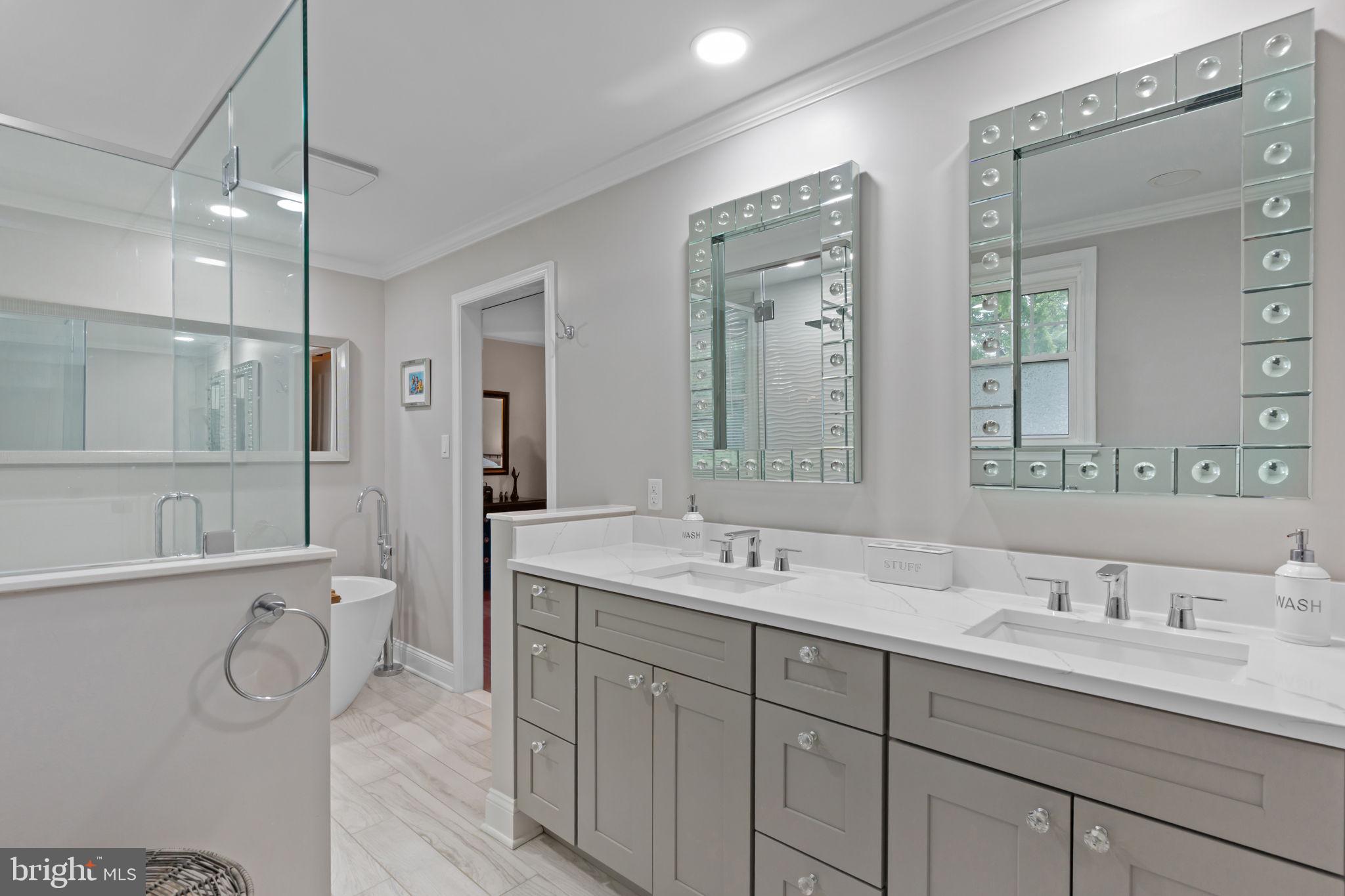 4 Keats Road Yardley, PA 19067 - Photo 36 of 65 a bathroom with a double vanity sink double mirror shower and a bathtub
