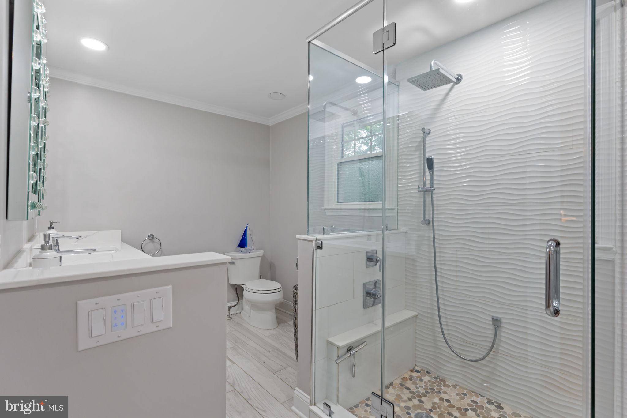 4 Keats Road Yardley, PA 19067 - Photo 38 of 65 a bathroom with a toilet sink and shower