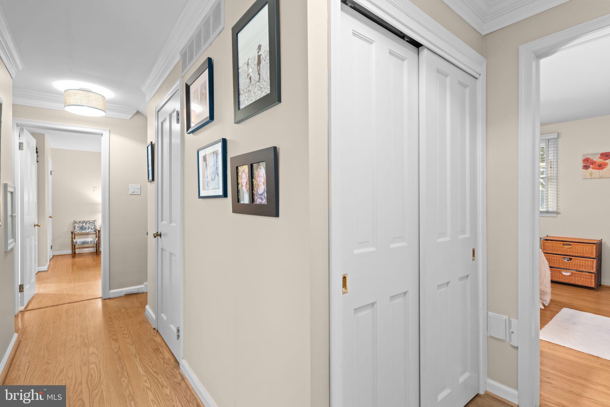4 Keats Road Yardley, PA 19067 - Photo 39 of 65 a view of a hallway with wooden floor and living room