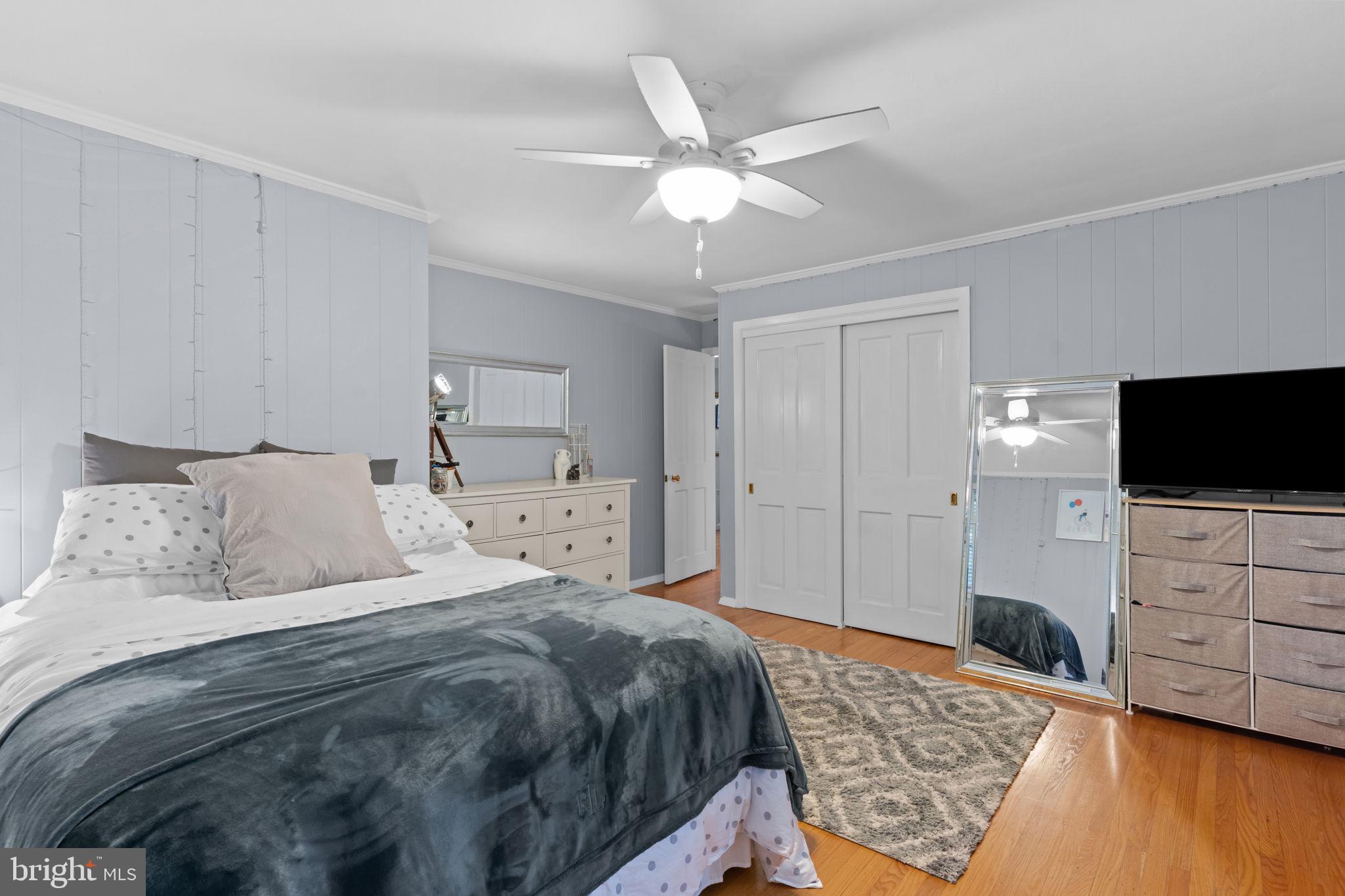 4 Keats Road Yardley, PA 19067 - Photo 40 of 65 a bedroom with a bed and a flat tv screen on dresser