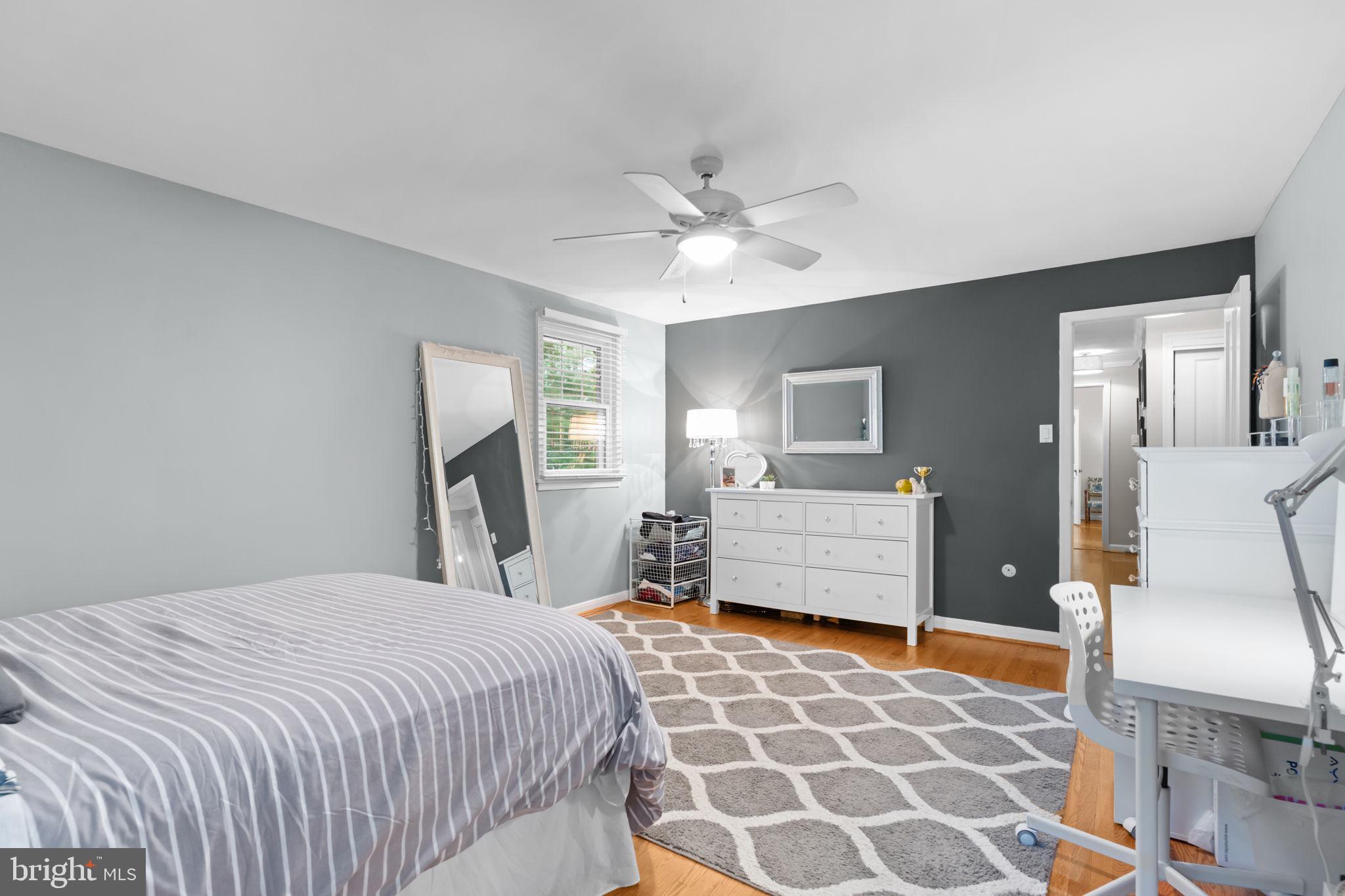 4 Keats Road Yardley, PA 19067 - Photo 42 of 65 a bedroom with a bed and wooden cabinets