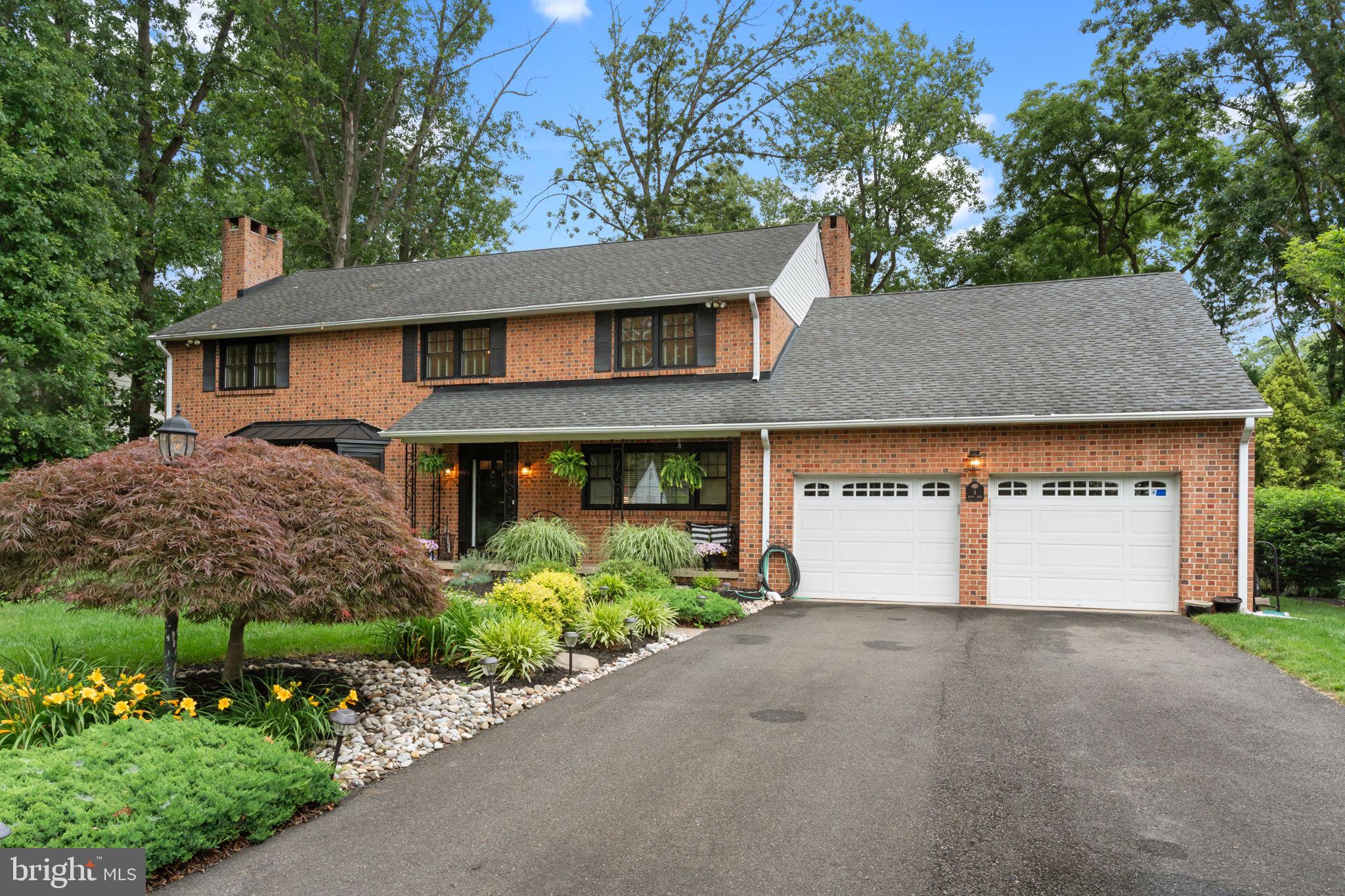 4 Keats Road Yardley, PA 19067 - Photo 54 of 65 a front view of a house with a yard and garage