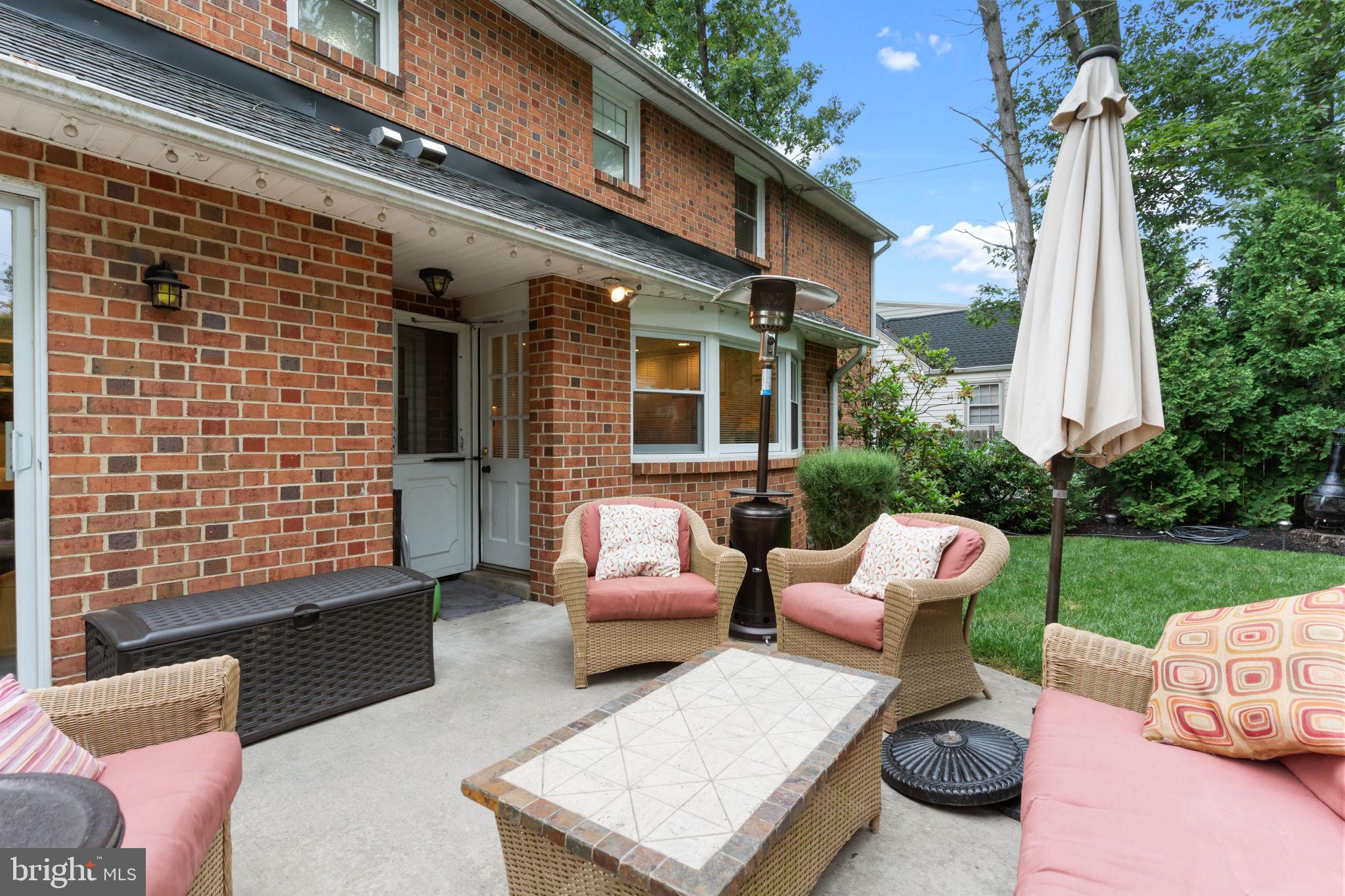 4 Keats Road Yardley, PA 19067 - Photo 59 of 65 a view of a patio with couches and table and chairs with wooden fence and plants