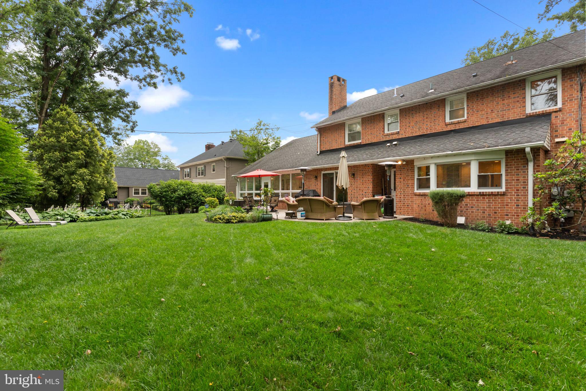 4 Keats Road Yardley, PA 19067 - Photo 65 of 65 a front view of a house with a yard table and chairs