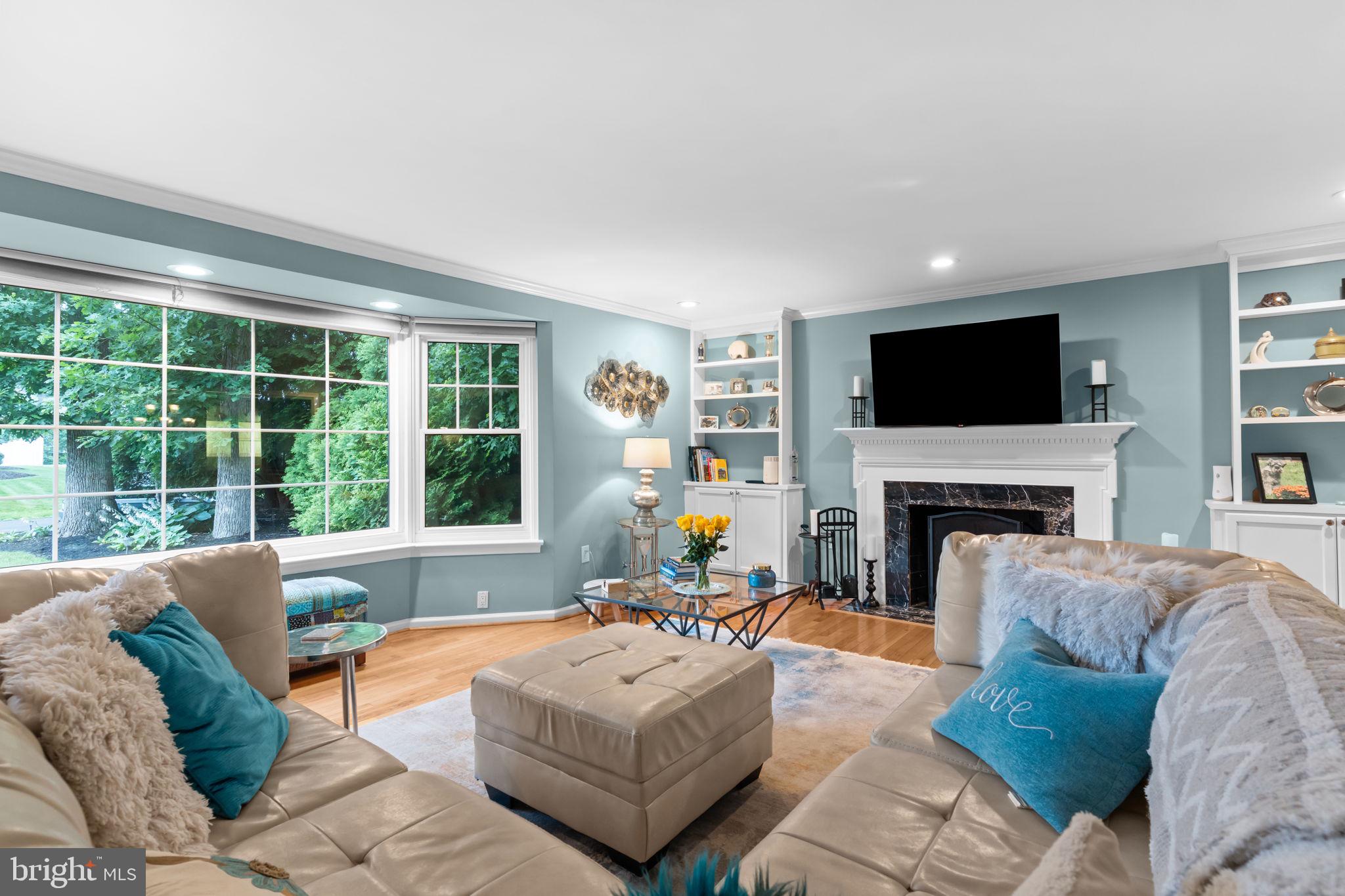 4 Keats Road Yardley, PA 19067 - Photo 7 of 65 a living room with furniture a fireplace and a flat screen tv
