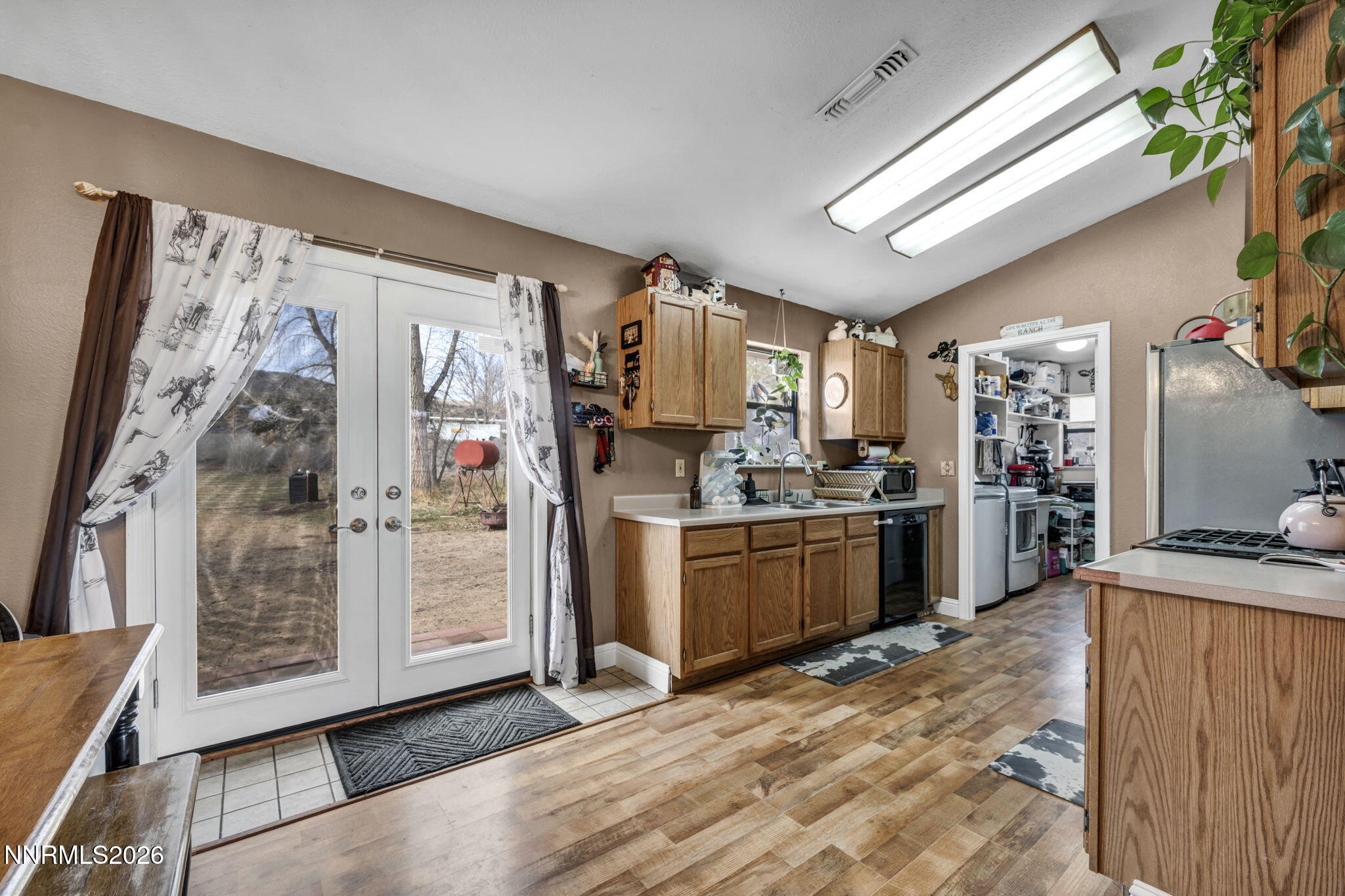 55 Buckboard Circle Reno, NV 89508 - Photo 12 of 39 a kitchen with a refrigerator and a stove