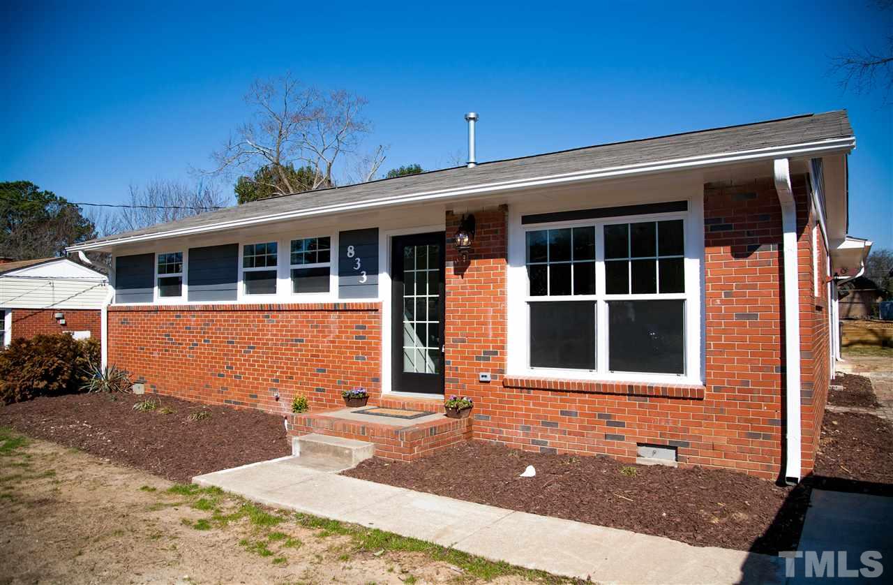 833 Newcombe Road Raleigh, NC 27610 - Photo 2 of 25 a front view of a house with a yard
