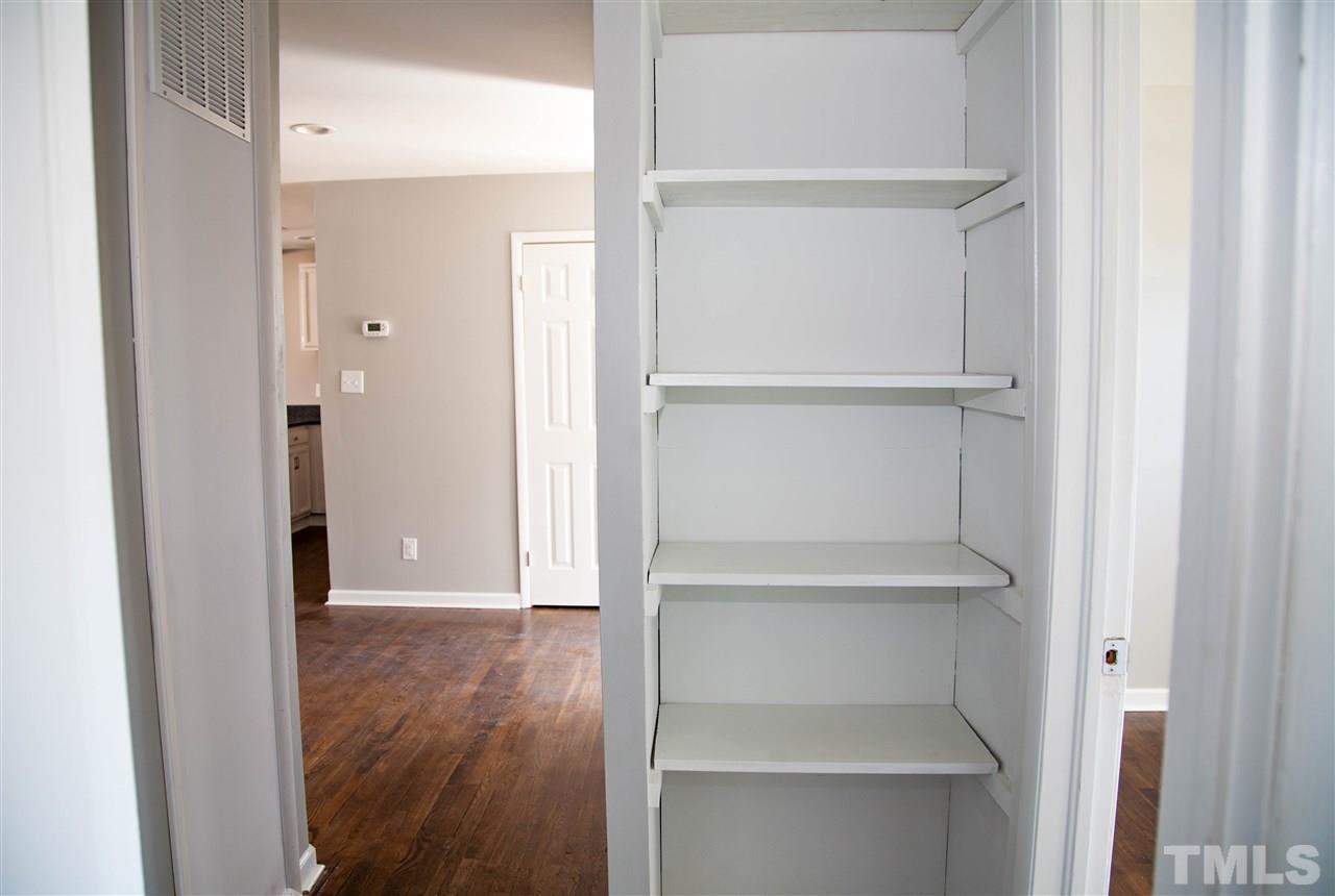 833 Newcombe Road Raleigh, NC 27610 - Photo 17 of 25 a view of walk in closet with empty racks