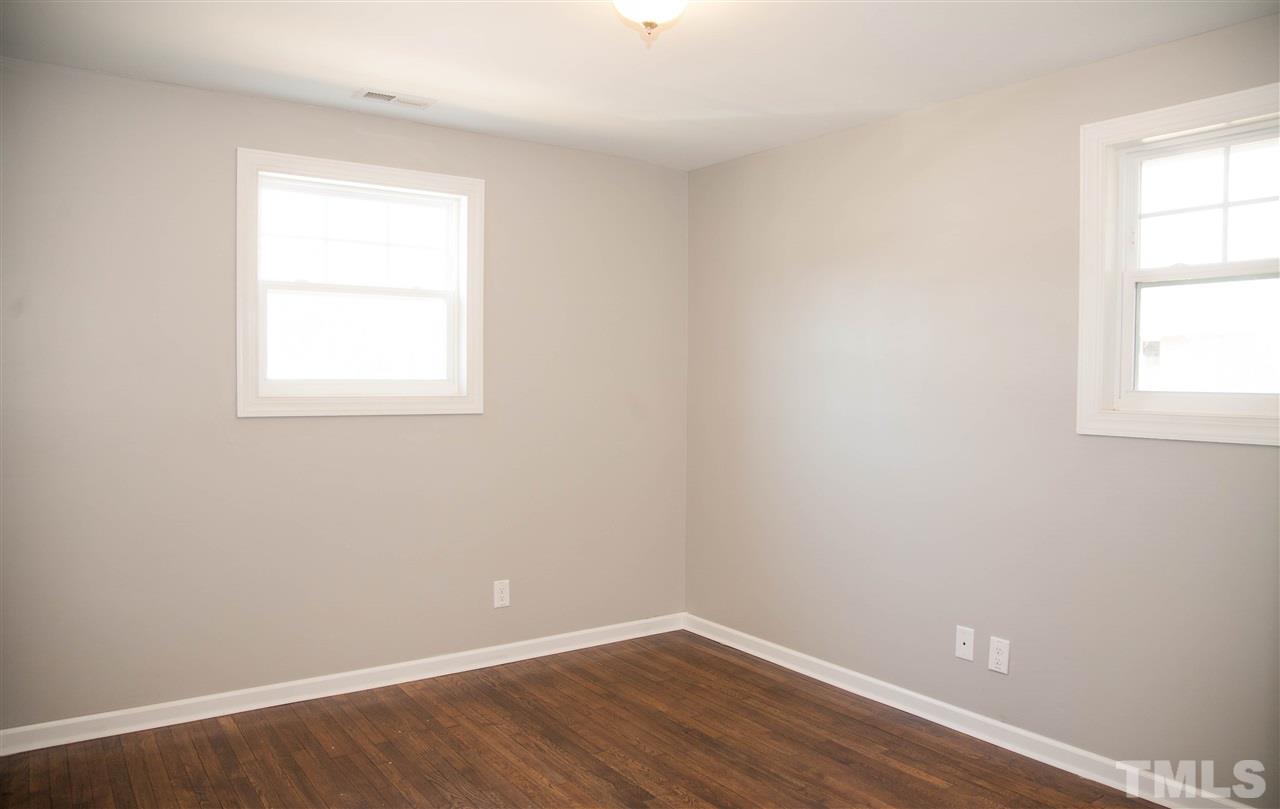 833 Newcombe Road Raleigh, NC 27610 - Photo 18 of 25 an empty room with a window