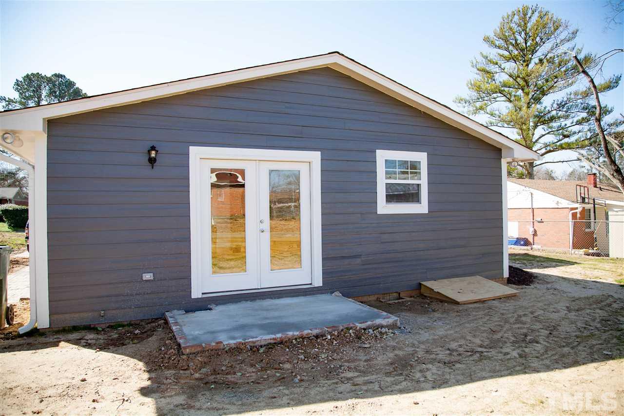833 Newcombe Road Raleigh, NC 27610 - Photo 24 of 25 a front view of a house with a yard