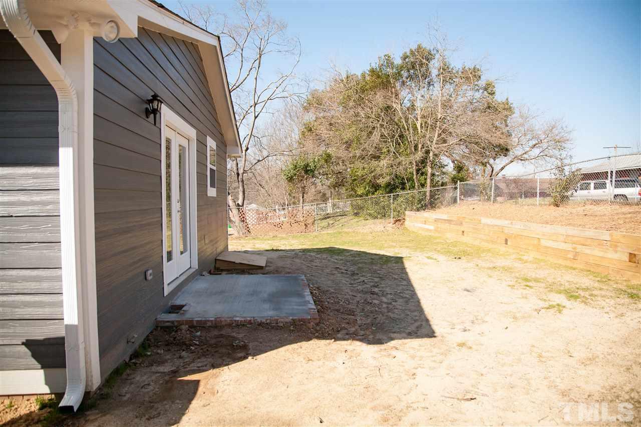 833 Newcombe Road Raleigh, NC 27610 - Photo 25 of 25 a view of a yard with snow on the road
