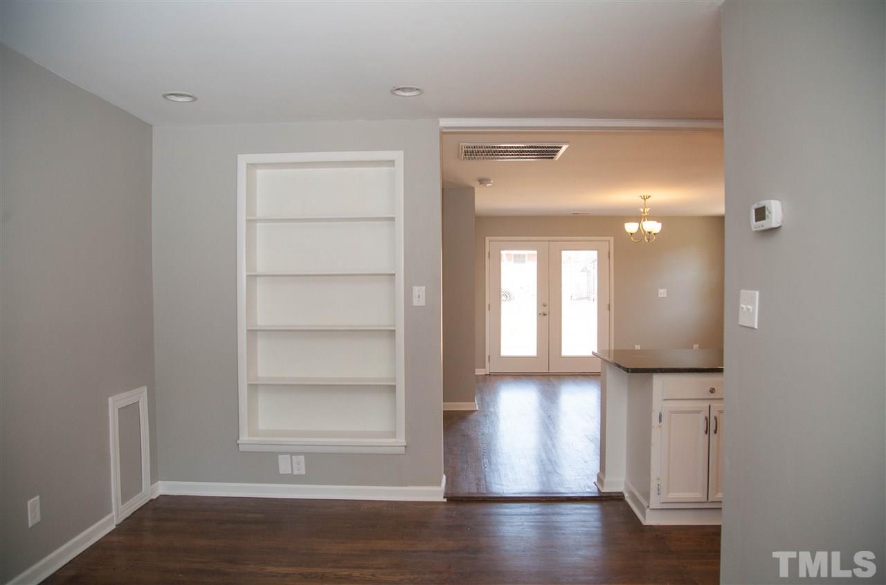 833 Newcombe Road Raleigh, NC 27610 - Photo 4 of 25 a view of empty room with wooden floor and fan