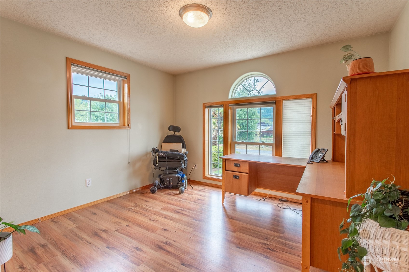 1847 Southwest Snively Avenue Chehalis, WA 98532 - Photo 19 of 32 a view of an empty room with a window and wooden floor