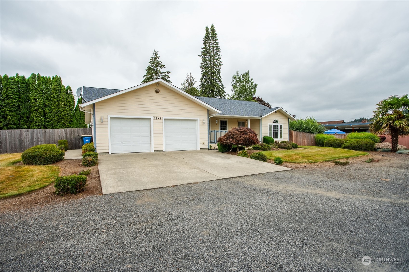 1847 Southwest Snively Avenue Chehalis, WA 98532 - Photo 3 of 32 a view of a house with a yard and garage